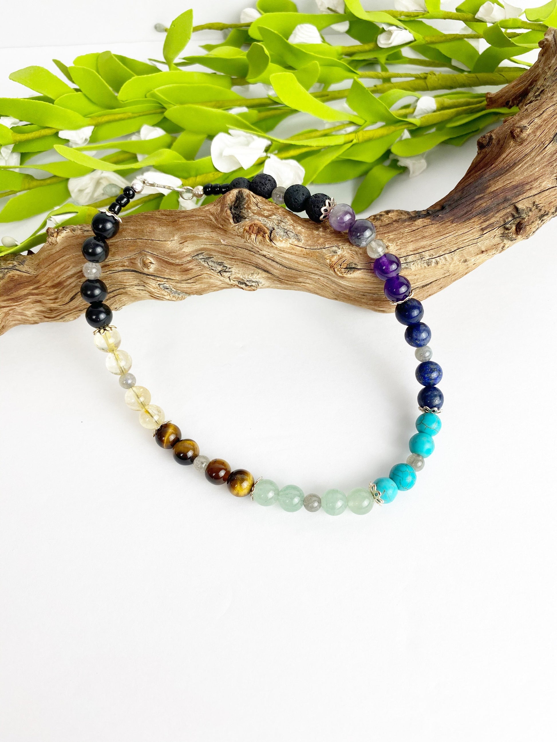 Patience and Stillness Crystal Breathbeads Meditation Mala.  Black, clear, brown, green, blue, dark blue, purple and lava beads.