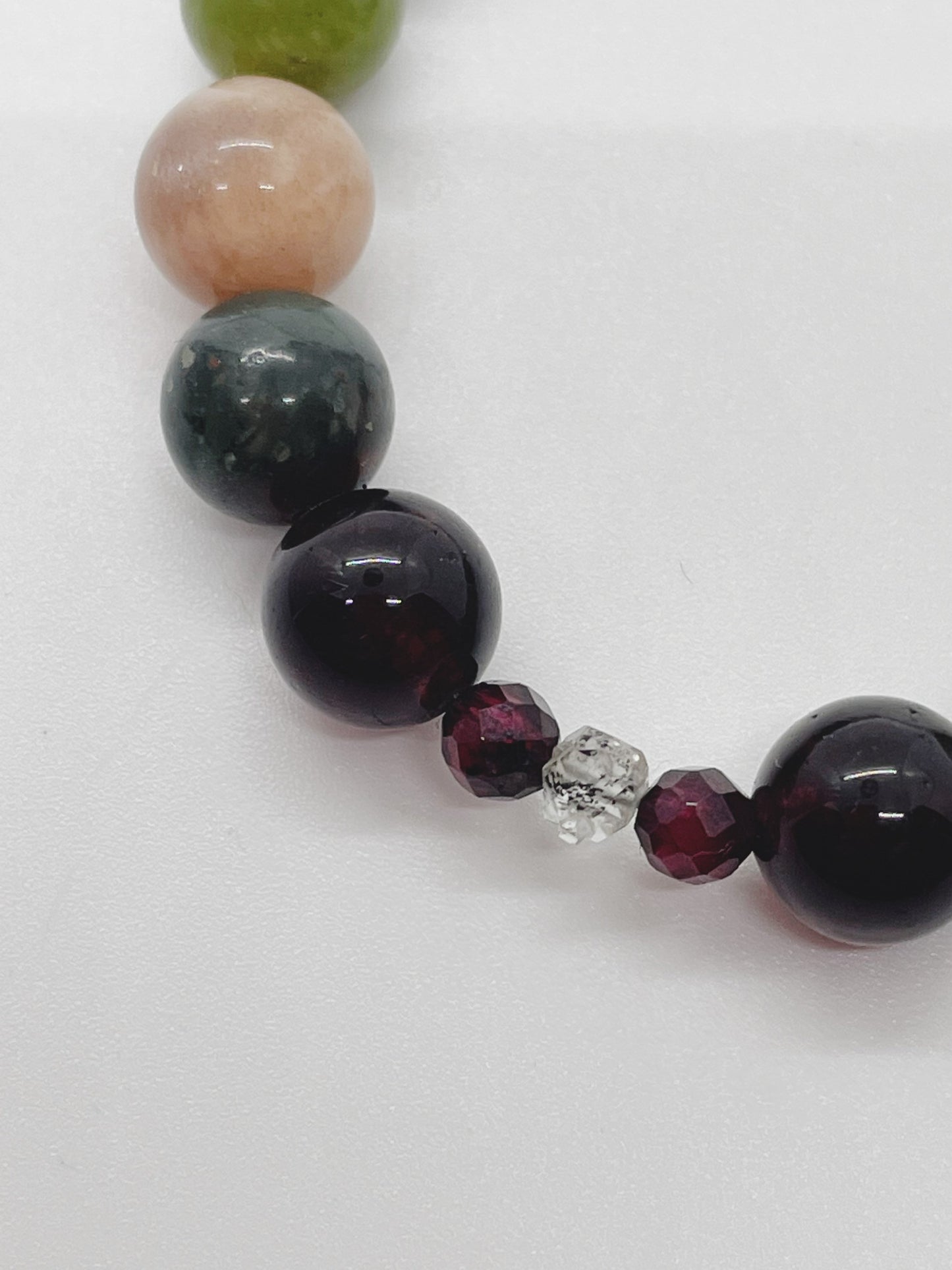 Crystal Beaded Chakra Bracelet. Garnet, Kerkimer Quartz, Bloodstone, Pink Moonstone, Jade, Apatite, Purple Aventurine, Pink Moonstone