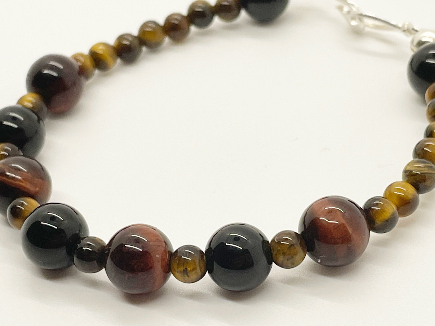 Calm and Clear Goal Getter Crystal Beaded Gemstone Bracelet with Tiger’s Eye, Black Onyx and Red Tiger’s Eye with Sterling Silver Closure