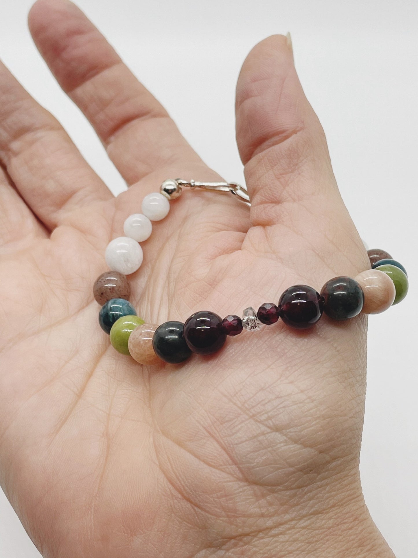 Crystal Beaded Chakra Bracelet. Garnet, Kerkimer Quartz, Bloodstone, Pink Moonstone, Jade, Apatite, Purple Aventurine, Pink Moonstone