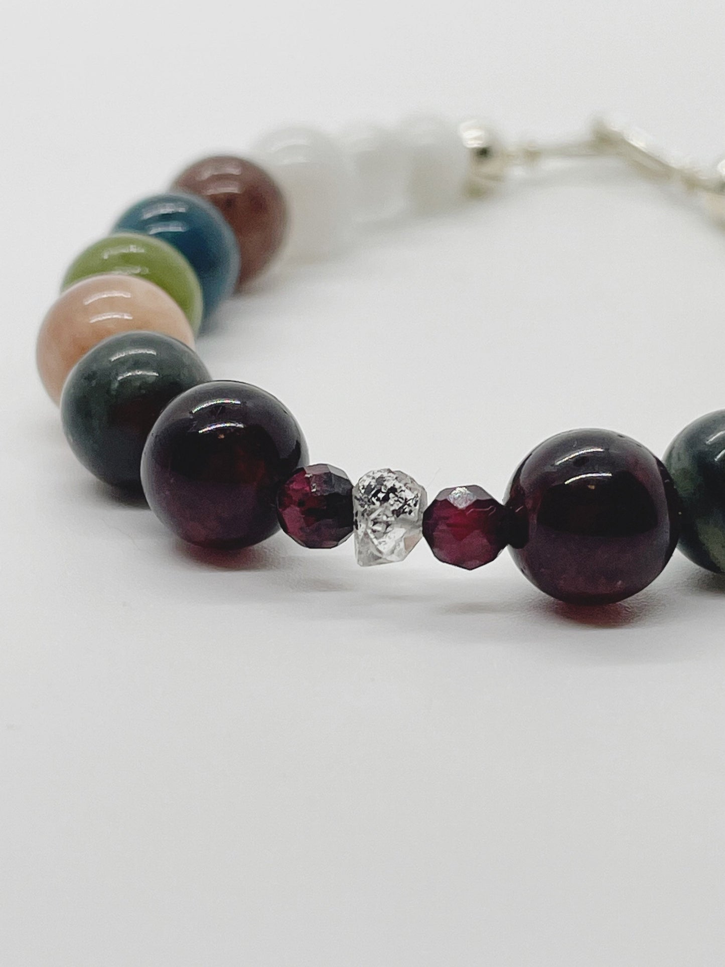 Crystal Beaded Chakra Bracelet. Garnet, Kerkimer Quartz, Bloodstone, Pink Moonstone, Jade, Apatite, Purple Aventurine, Pink Moonstone