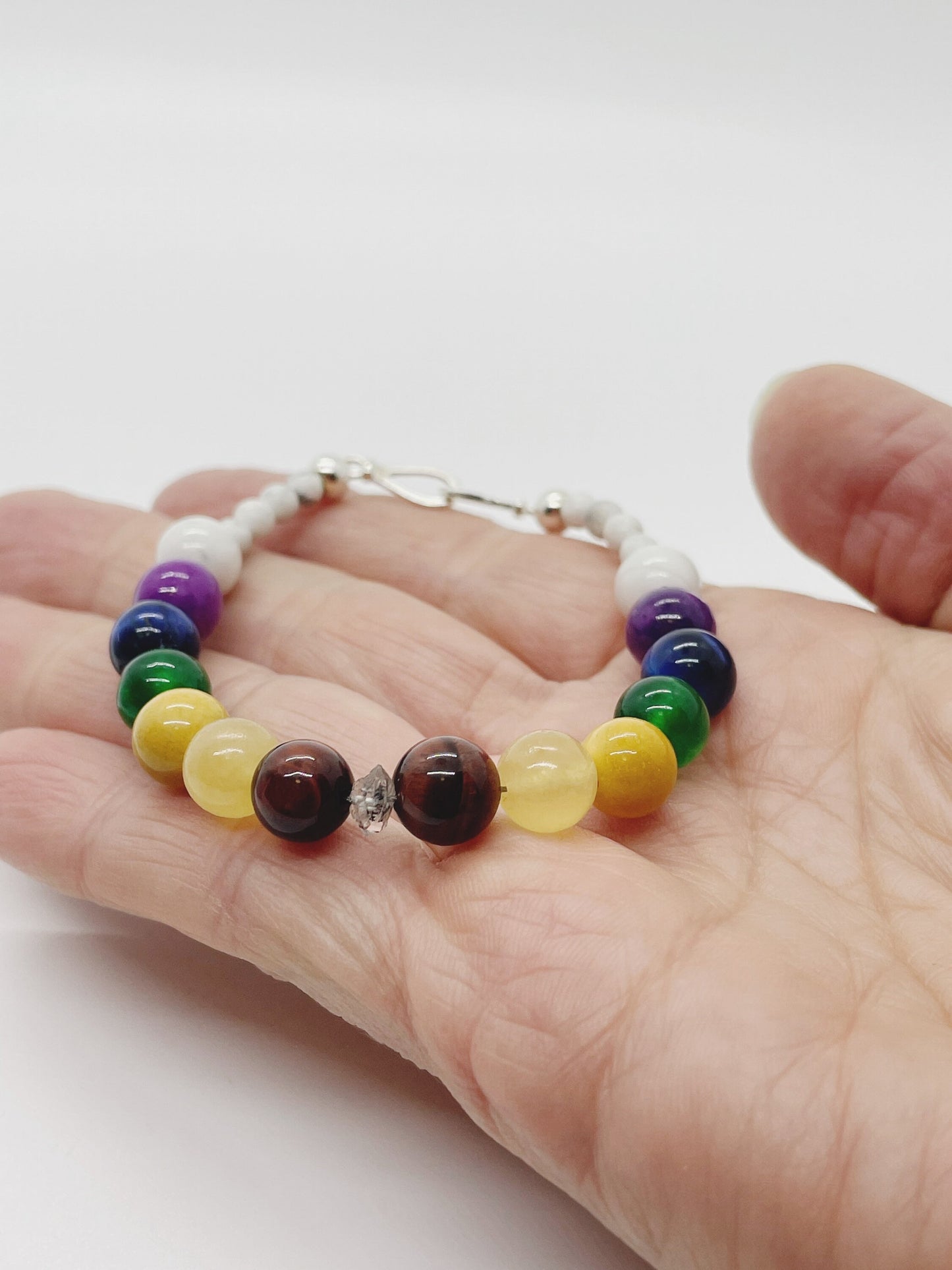 Crystal Beaded Chakra Bracelet.  Herkimer Quartz, Red & Blue Tiger’s Eye, Yellow Calcite,  Mookaite, Green Chalcedony, Sugalite, Sterling Silver