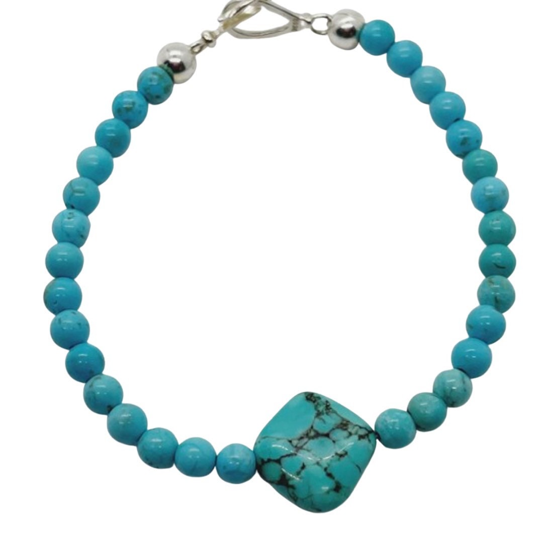 Turquoise and Turquenite Crystal Bracelet with Sterling Silver Clasp.  Blue beads with a square large bead in center.