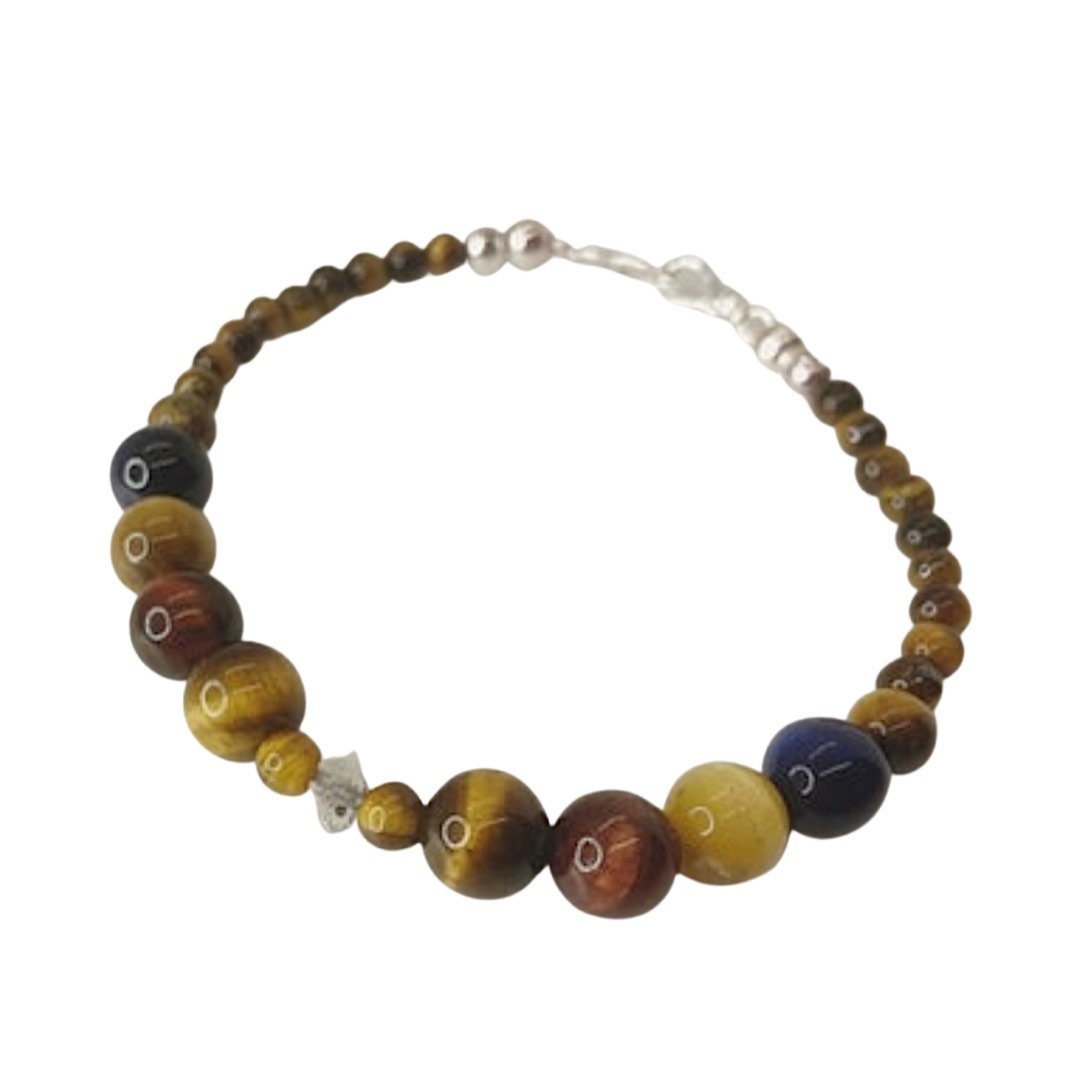 Gemstone Healing Bracelet. Tigers Eye and Herkimer Quartz with Sterling Silver.  Shades of yellow and brown with a herkimer quartz in the middle.